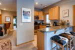The condo has a fully equipped kitchen that has granite counter tops and stainless steel appliances